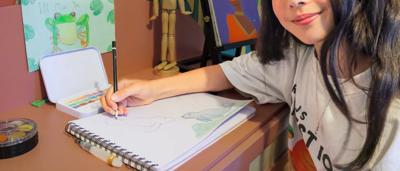 Lola's drawing: girl, colorful crayon art, house, sun, trees, grass.