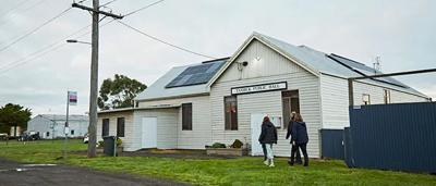Yambuk Hall with solar panels on roof, sunny day.