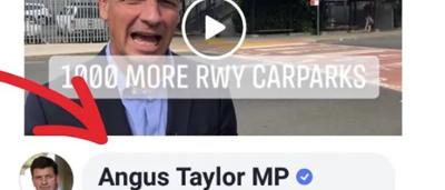 Man in suit, smiling, headshot.