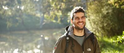 Woman, Jess Abrahams, ACF Campaigner, smiling, outdoors, trees in background.