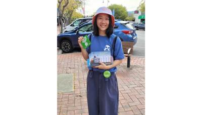 A vibrant graphic with text and shapes, featuring a stylized tree and abstract elements.