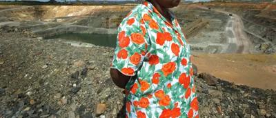 Jabiru bird standing in water, long beak, black and white plumage.