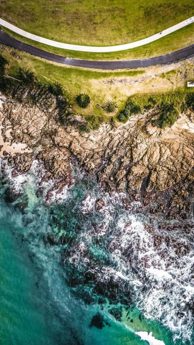 Sea side road, asphalt, ocean view, blue sky, white clouds.