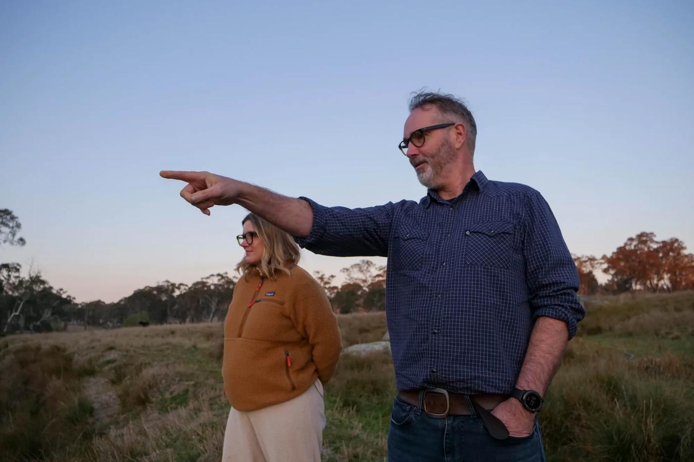 Paul Sinclair and ACF's Freya Cole looking for platypus at Tim Wright's regenerative farm, LANA, in Balala, NSW