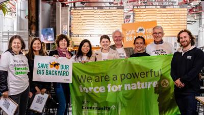 Community group logo: stylized tree canopy, green leaves, blue background.