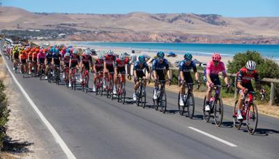 Cyclists riding bikes on a road, header image.