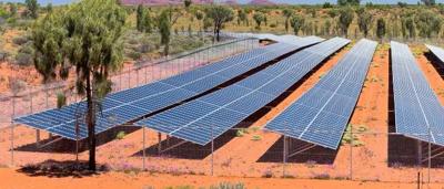 Solar panels on a roof, Outback Solar logo visible. Blue sky background.