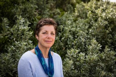 Woman, Helen Fisher, smiling, headshot, professional attire.