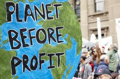 Planet Profit graphic: Earth with a growing plant, money, and gears, symbolizing sustainable business.