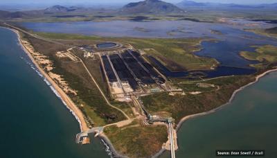 Header image: Abbot Point coal spill. Dark water, coastline, and industrial structures.