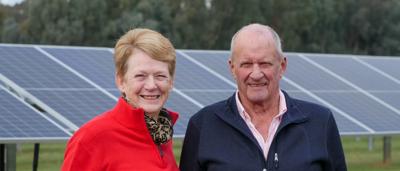 Solar farm panels, Glenrowan, Australia. Vast array of photovoltaic cells under a blue sky.
