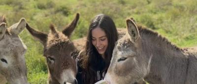 Woman, Natalie Kyriacou, smiling, headshot, professional attire.