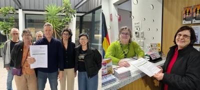 Volunteers dropping off open letter, MP office, building exterior, people, envelopes.