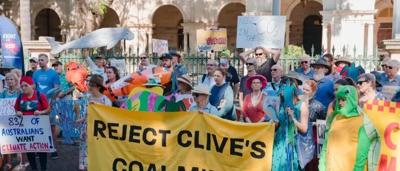 Protest banner, crowd, Palmer, signs, Australian flag, street.