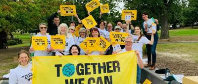 Protest banner, crowd, Chisholm Day of Action, April 12, 2022.