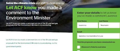 A hand holding a sign with "Let Us Know" text.