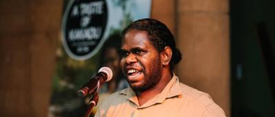 A Jabiru stork standing in water, long beak, black and white feathers, Australian wetland.