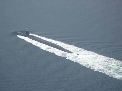 Submarine crusing above sea level