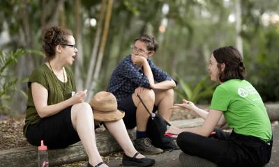 Header image: Two people, seated, conversing.
