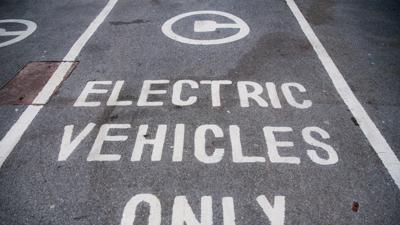 Electric vehicle, JCT600, header image. Car parked, modern design, blue and white.