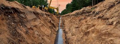 Beetaloo Pipeline header image. Pipeline construction across a landscape.
