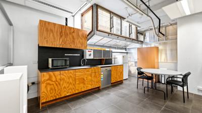 Victorian terrace house, 60 Leicester Street, Carlton, Melbourne. Brick facade, ornate details, street view.
