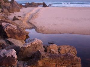 Coastal landscape, Croajingalong National Park. Sandy beach, ocean, headland, blue sky.