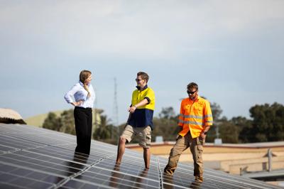 Off-grid solar panel array powering a building.