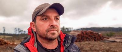 Man in field, Yarrowitch, looking at camera.