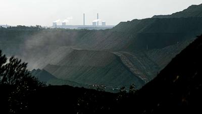 Mount Thorley Warkworth coal mine with Bayswater bituminous coal-powered Power Station in distance.