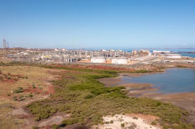 Aerial view of Karratha, Western Australia. Buildings, roads, and coastline visible.