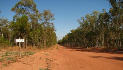 Snowy mountain landscape with a ski resort, blue sky.