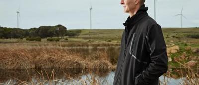 Yambuk, coastal landscape. Green hills meet ocean, blue sky.
