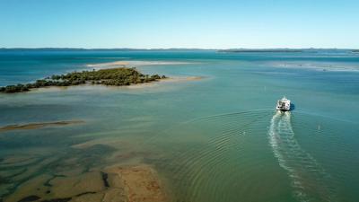 Toondah Harbour, Queensland. Aerial view of water, boats, and land.