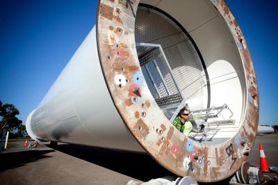 Header image: Portland manufacturing scene, industrial buildings, blue sky.