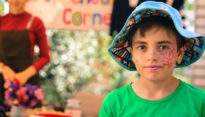 Boy snorkeling, coral reef, underwater scene, vibrant fish, blue water.