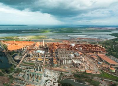 Header image: Person in field, holding a sign, with text and a logo.