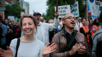 Header image: Group of diverse people, smiling, outdoors.