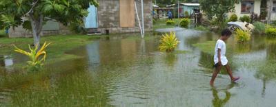 Fiji COP26 header image: Tropical island, palm trees, ocean, text overlay.