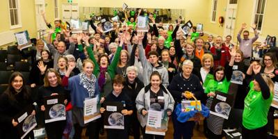 Header image: Group of diverse people, arms raised, silhouetted against a colorful background.