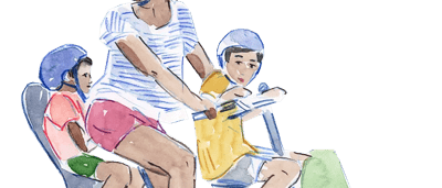 A person riding a bicycle on a path, trees in the background.