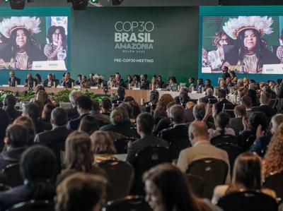 COP30 opening ceremony stage with crowd and speakers.