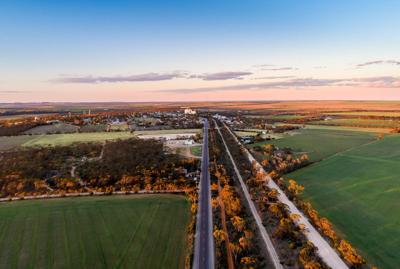 Kimba landscape, wheat field, blue sky, wind turbines.
