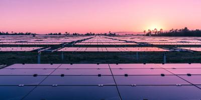 Geoff Hunter, Kidston Genex Power, header image. Man in hard hat, power plant in background.