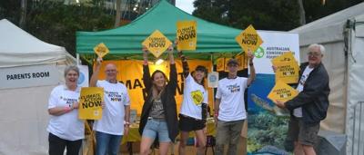 Midnight Oil concert photo, Brisbane, April 2022. Band on stage, crowd in front.