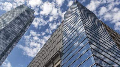 Header image: Finance, graphs, charts, and a building silhouette.