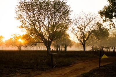 Sandridge Outstation on Rumburriya Country. Desert landscape, building, blue sky.