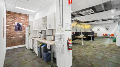 Victorian building, Leicester Street, Carlton. Five-story facade, ornate details, street view.