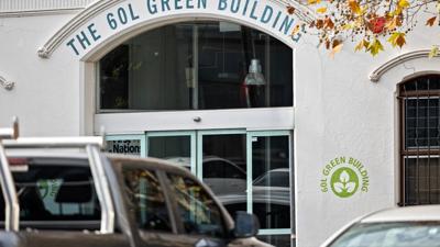Victorian terrace house, 60 Leicester Street, Carlton, Melbourne. Two-story, brick facade.