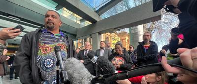 Rawlinson Award trophy on a table, with a blurred background.